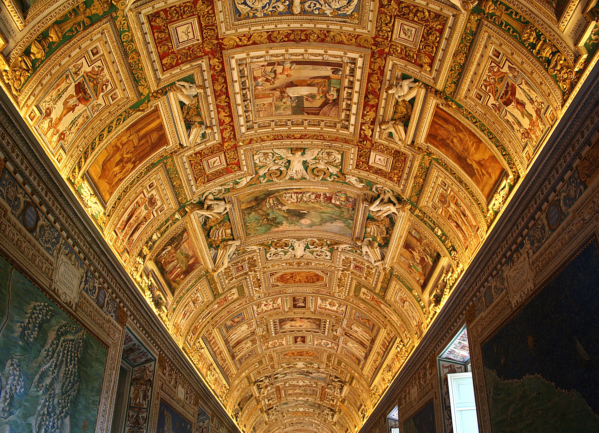 The gilded vault of the Gallery of Maps in the Vatican Museums, with painted maps of Italy along the side walls