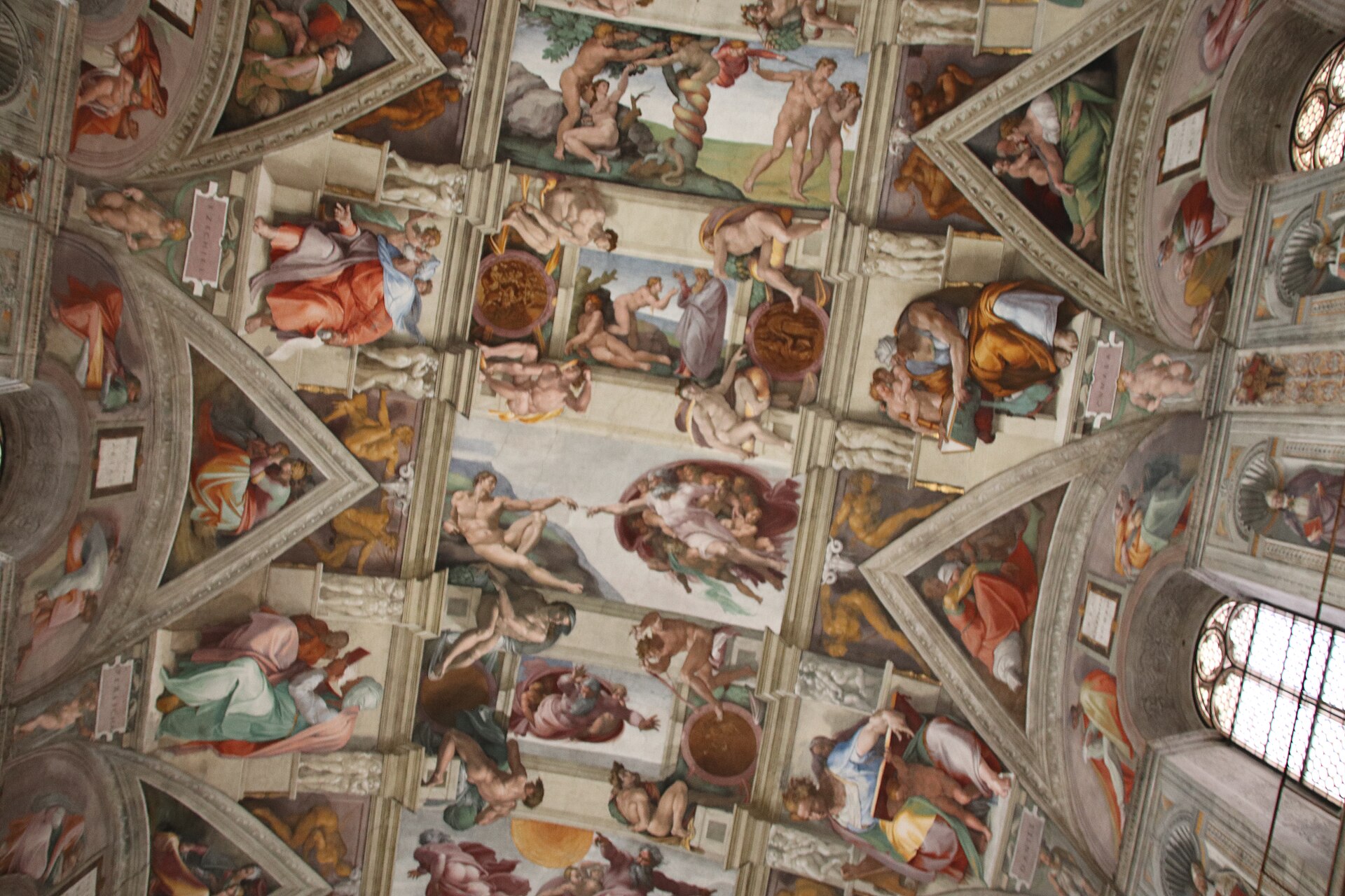 The ceiling of the Sistine Chapel painted by Michelangelo, with the Creation of Adam at the centre