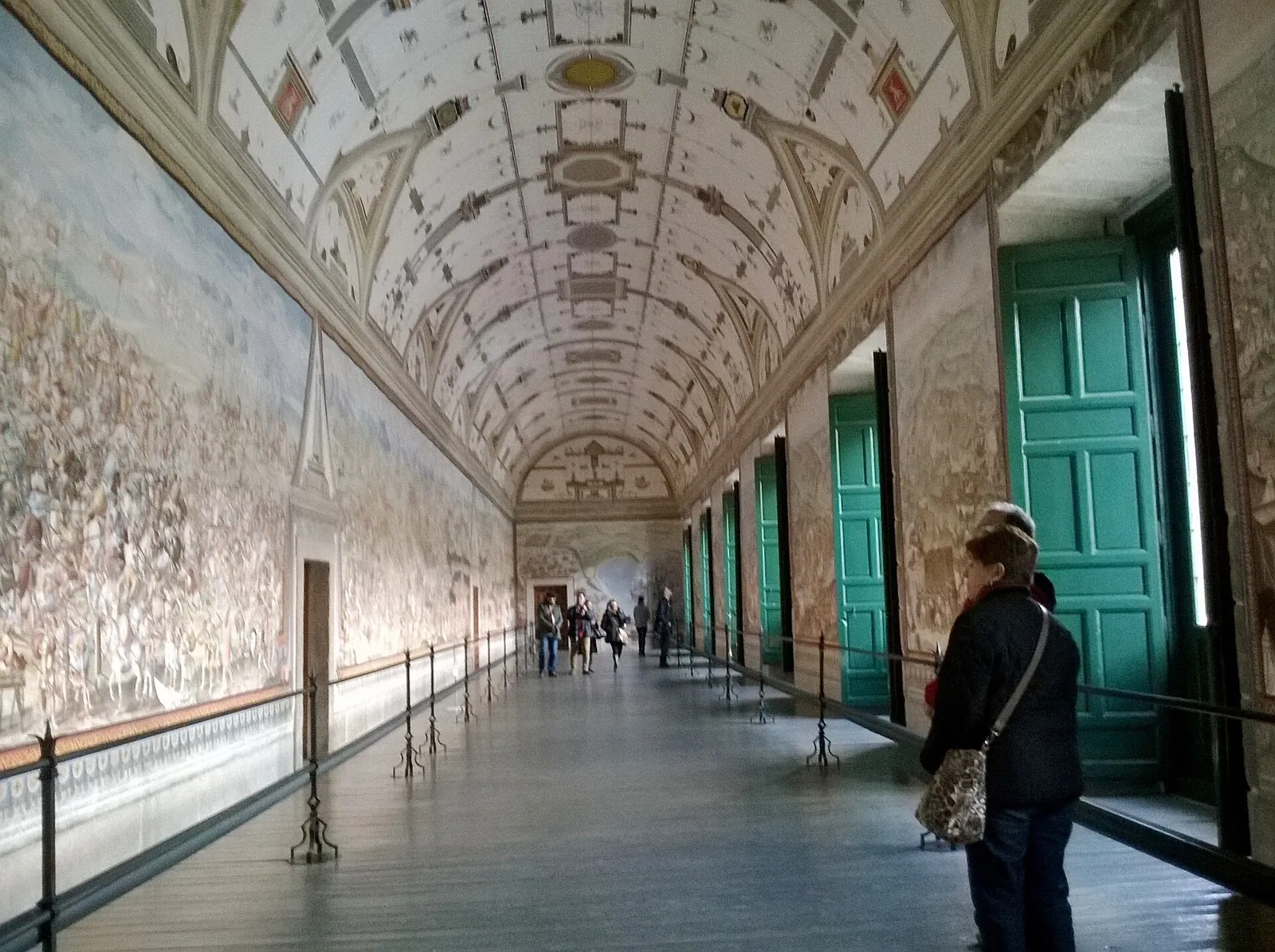 Hall of Battles at El Escorial: a long gallery with a decorated vault and battle-scene frescoes running along the wall