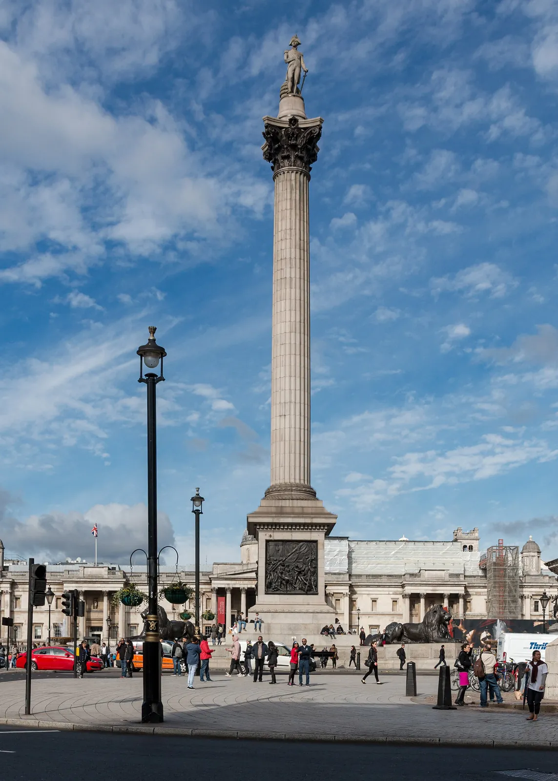 Nelson's Column in full, granite with a bronze capital, with the admiral's statue on top and the square at its foot