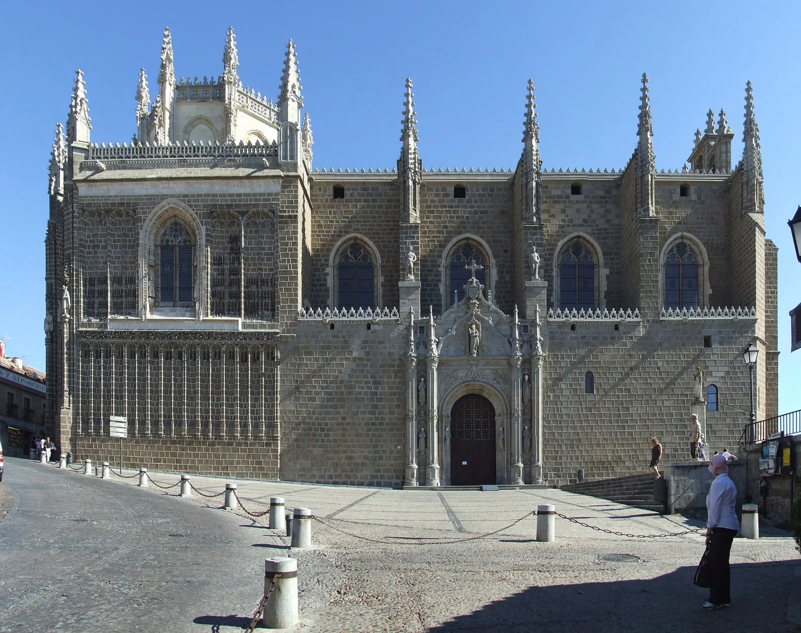 The outside of the church of San Juan de los Reyes from the square, with its doorway, the pinnacles and the lantern tower on the left