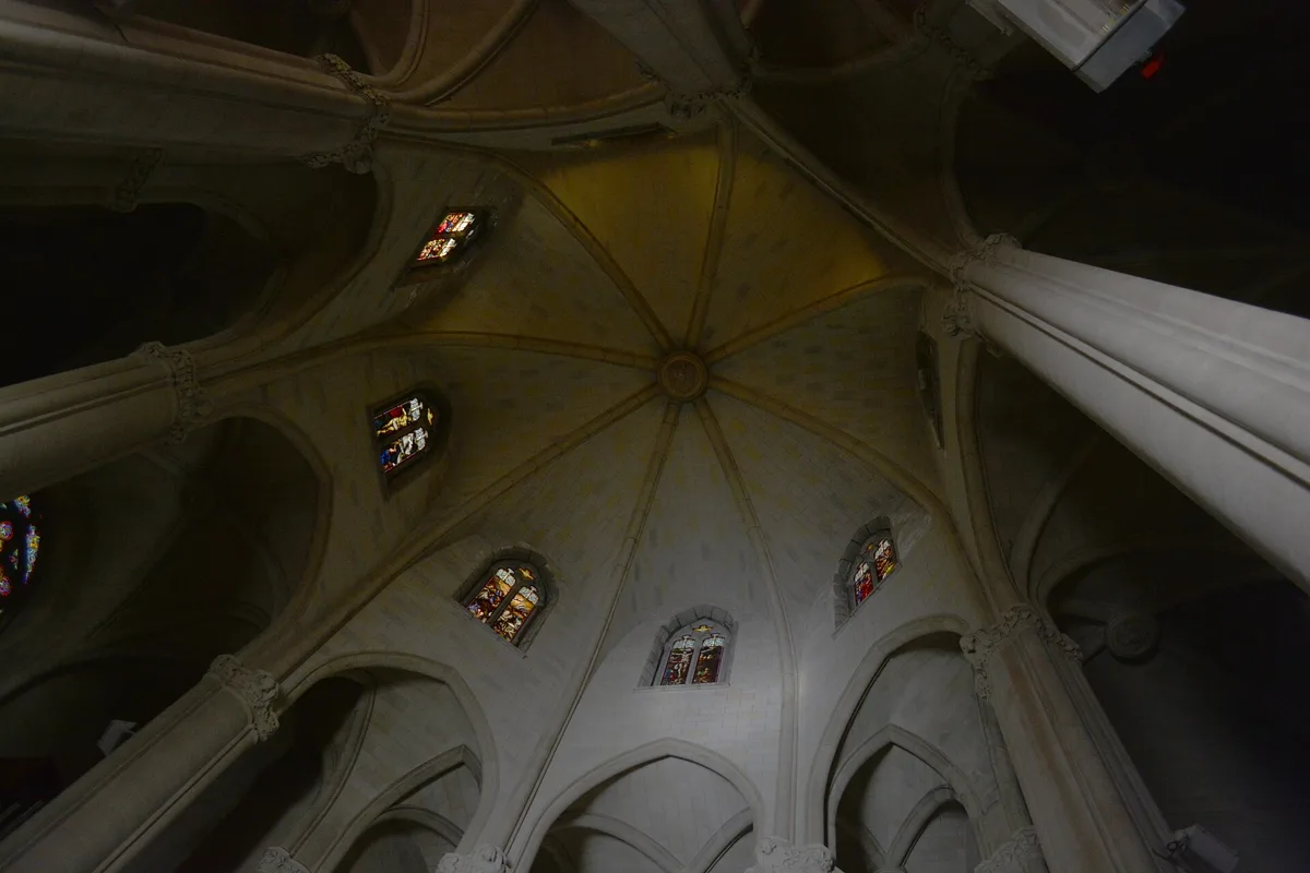 The ribbed vault and pointed windows of the upper church of the Temple of the Sacred Heart on Tibidabo, seen from below
