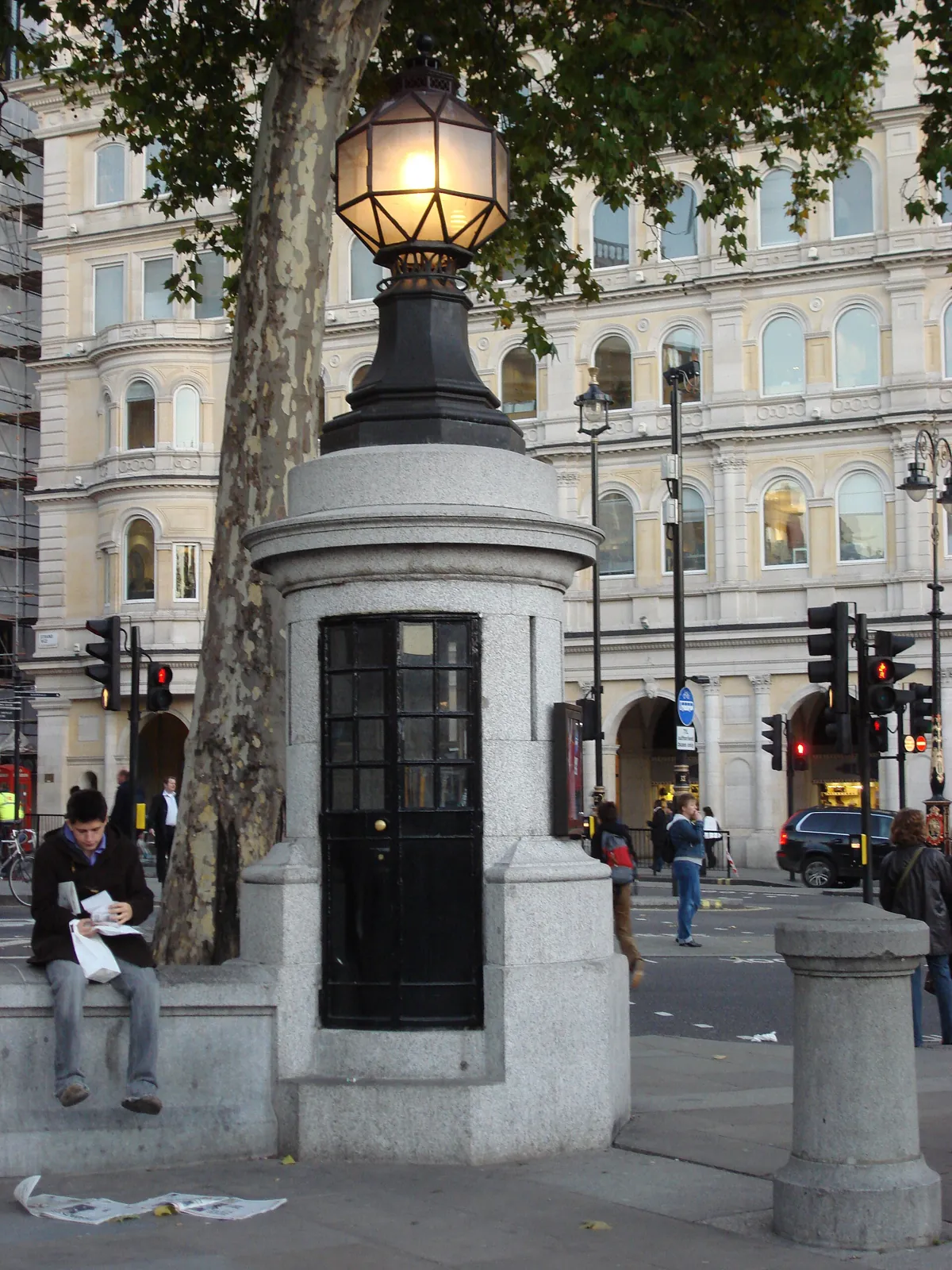 The tiny stone police box on the south-east corner of the square, with a narrow door and a lamp on top