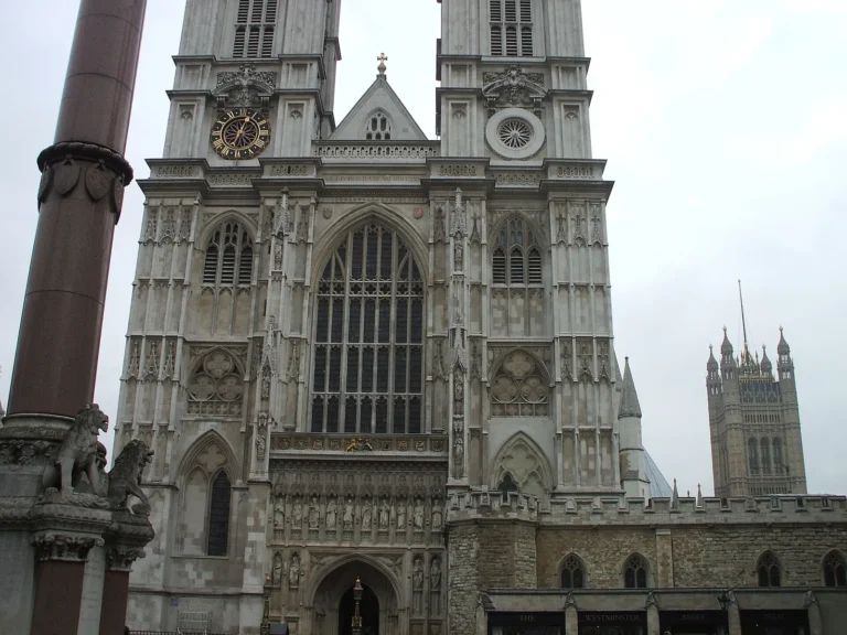 The west front of Westminster Abbey with its two Gothic towers and, on the right, the Victoria Tower of the Palace of Westminster